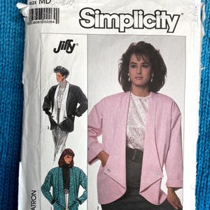 May include: Simplicity sewing pattern number 8176, size MD, Jiffy, for a pink, black, and teal jacket. The pattern includes three different styles of jackets.
