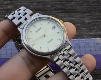 Seiko 7N42-8A60 Men's Titanium Waterproof Ivory Dial Quartz