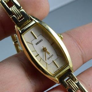 Vintage Seiko Lucent 4N21 5360 dameshorloge met parel wijzerplaat Japan JDM kussenvorm 18 mm