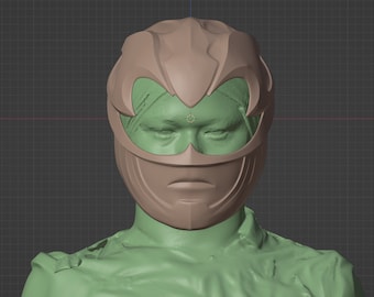 May include: A 3D model of a green Power Ranger helmet with a brown visor and a detailed design. The helmet is sculpted in a 3D modeling program.
