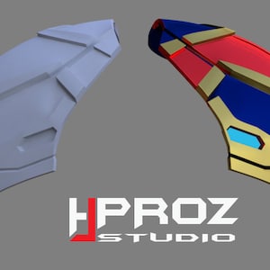 Può includere: Un modello 3D di una protezione per il braccio di un supereroe. Il modello è mostrato in due viste: una versione bianca non verniciata e una versione verniciata con accenti rossi, blu, oro e blu chiaro.