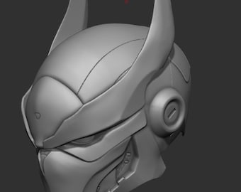 May include: A gray 3D printed model of a futuristic helmet with a pointed design and intricate details.