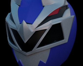 May include: A blue and silver helmet with a visor and a red eye. The helmet has a sharp, angular design with a pointed top.