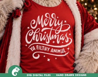 May include: A bright red sleeveless shirt featuring white text that reads Merry Christmas YA FILTHY ANIMAL in a stylized script and block font, accented with small four-pointed star shapes, worn under a red velvet coat with white faux fur trim.