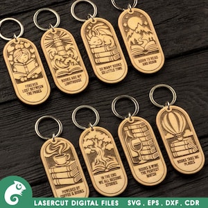 May include: Eight light-colored wooden keychains with rounded tops, each featuring laser-engraved illustrations and text including phrases like Forever Lost Between The Pages, Books Are My Lighthouse, So Many Books So Little Time, Born To Read And Roam, Powered By Coffee & Books, In The End We All Become Stories, Books & Wine The Perfect Match, and Books Take Me Places.