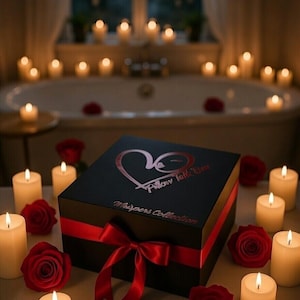 May include: A black gift box with a red ribbon and the text "Pillow Talk Love Whispers Collection" is surrounded by lit candles and red roses. The scene is set in a dimly lit room with a bathtub in the background.