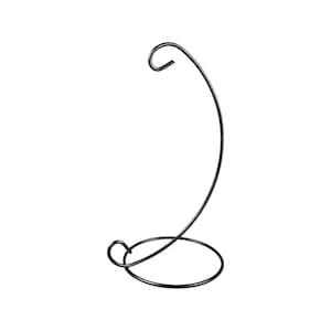 May include: Black metal stand with a curved arm for hanging a glass ornament or other decorative item.