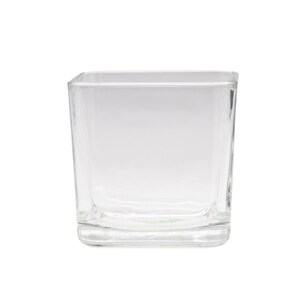 May include: A clear glass square vase with a thick base.