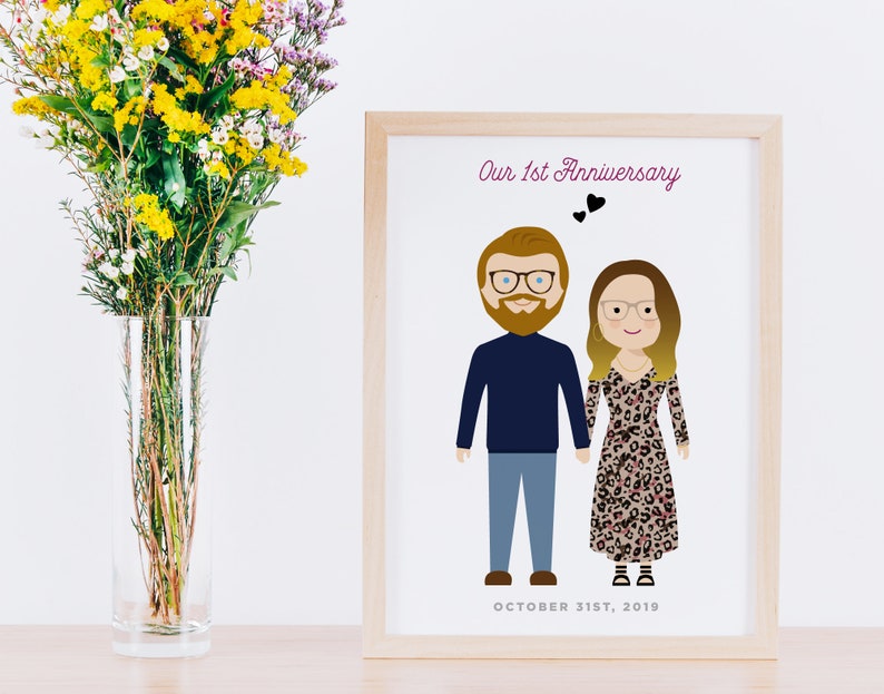 May include: A framed illustration of a couple with the text "Our 1st Anniversary" and "OCTOBER 31ST, 2019" below the illustration.