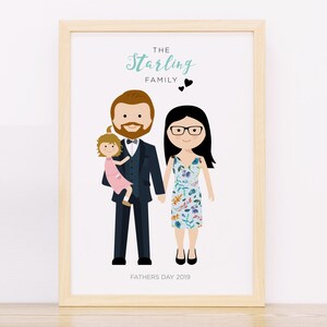 May include: A framed illustration of a family with a father holding a young girl, a mother standing next to him, and the text "The Starling Family" above them. The text "Fathers Day 2019" is below the family.