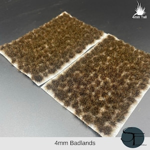 Puede incluir: Dos hojas de mechones de hierba estática marrón de 4 mm de altura, ideales para crear un terreno de badlands para juegos de guerra en miniatura o modelismo ferroviario.