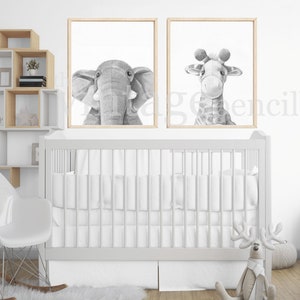 May include: A white crib with a white rocking chair and a white shelf unit with a gray elephant and giraffe print on the wall.