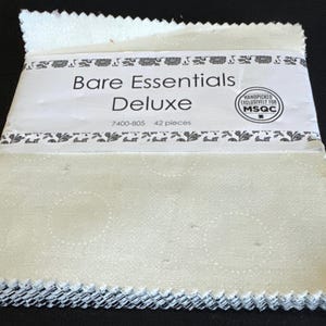 May include: A stack of 42 cream-colored fabric squares with pinked edges, labeled Bare Essentials Deluxe, 7400-805, 42 pieces, and Handpicked Exclusively for MSQC. The fabric features a subtle, repeating circular pattern in a matching cream tone.