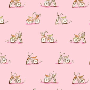 May include: A repeating pattern on a light pink background featuring hand-drawn illustrations of bicycles. Each bicycle is rendered in brown and orange tones with green seats and small baskets containing flowers, arranged in a grid-like layout.