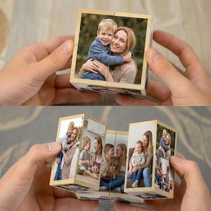 May include: A wooden photo cube displaying multiple family photos. The cube is held in a person's hands, with images of a mother and child visible. The cube is designed to be rotated to reveal different images.