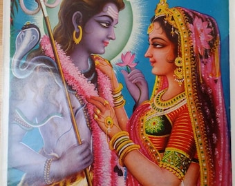 May include: A vintage print depicting Hindu deities. A blue-skinned figure with a trident and a woman in a red sari are shown. The woman offers a lotus flower. The print has text in English and Hindi.