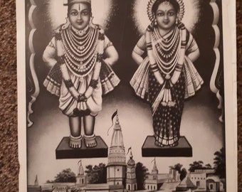May include: Black and white image of a Hindu deity couple, Shri Vithoba and Rakhumai, standing on platforms with a temple and river scene in the background. The image includes the text "Shri Vithoba Rakhumai" and "Sharma Picture Publication".