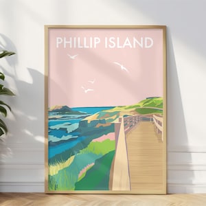 May include: A pink and green illustrated poster with the text "PHILLIP ISLAND" at the top. The poster depicts a wooden boardwalk leading to a view of a coastline with green hills and blue water.