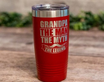 May include: Red stainless steel tumbler with a silver lid. The tumbler has the text "Grandpa The Man The Myth The Legend" with a mustache graphic.