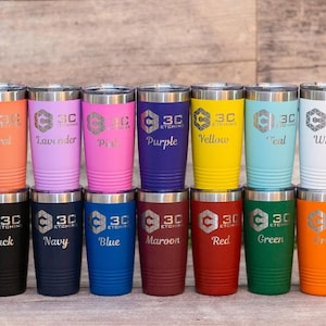 May include: A set of 12 stainless steel tumblers with various colors and engraved text. The tumblers are arranged in two rows of six. The text on the tumblers includes "3C Etching", "Coral", "Lavender", "Pink", "Purple", "Yellow", "Teal", "White", "Black", "Navy", "Blue", "Maroon", "Red", "Green", and "Orange".