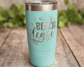 May include: A turquoise stainless steel tumbler with a silver lid. The tumbler has a white design that says "Beach Please" with a star and bubbles.