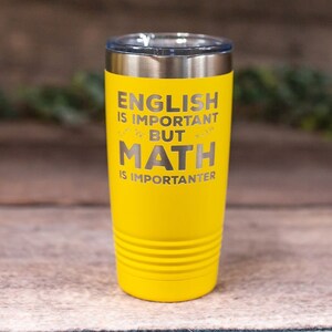 May include: Yellow stainless steel tumbler with the text "English is important but math is importanter".