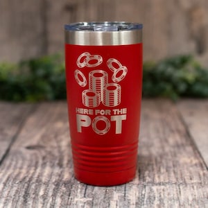May include: A red 20 oz tumbler with a silver lid. The tumbler features an engraved design of poker chips and the text "HERE FOR THE POT". The tumbler has a ridged design near the base.