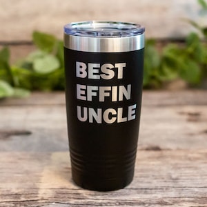 May include: Black stainless steel tumbler with a silver lid. The tumbler has the text "BEST EFFIN UNCLE" engraved on the front.