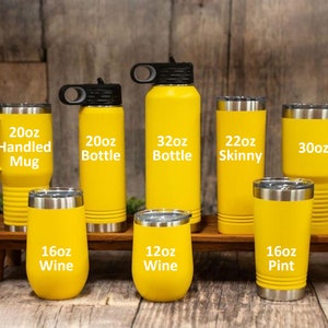 May include: A collection of yellow stainless steel tumblers in various sizes, including 15oz, 20oz, 16oz, 12oz, 22oz, 30oz, and 20oz. The tumblers are labeled with their size and type, such as "Handled Mug", "Wine", "Skinny", and "Pint".