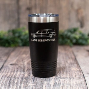 May include: Black stainless steel tumbler with a white outline of a hearse and the text "LAST RESPONDER".