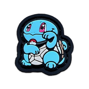 May include: A blue and white cartoon turtle character with pink eyes and a red and white Pokeball. The character is holding the Pokeball in its right hand. The character is surrounded by a black border.
