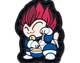 May include: A cartoon-style patch featuring a character with red spiky hair, wearing a blue and white outfit. The patch has a black border and depicts the character smiling and holding a small object. The overall design is vibrant and detailed.