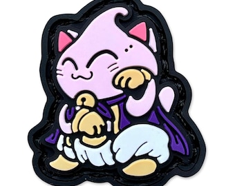May include: A pink cat-like character patch with a smiling face, wearing a purple cape and holding a golden object. The patch has a black border and white accents. The design is cartoonish and playful.
