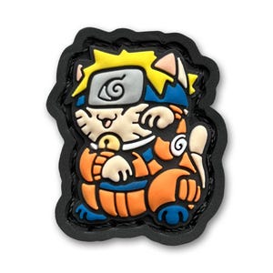 May include: A black and orange 3D patch featuring a cartoon cat wearing a blue and orange ninja outfit. The cat has yellow hair and a headband with a swirl design. The patch is made of rubber and has a black border.