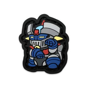 May include: A colorful robot patch with a black border. The robot is primarily blue, gray, and red, with yellow accents. The design is a cartoon-style illustration of a robot.