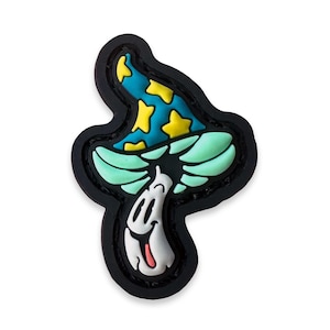 May include: A colorful mushroom-shaped patch with a smiling face and a wizard hat. The hat is blue with yellow stars, the gills are light green, and the stem is white. The patch has a black border.