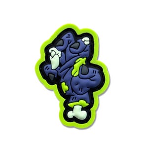 May include: A green and purple zombie-themed patch with a cartoon zombie character. The patch is made of rubber and has a stitched border.