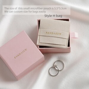 pink jewelry gift boxes, ivory jewelry bag inside