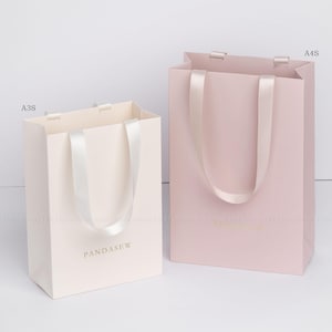 ivory and dark pink paper bag vertical style, personalized jewelry packaging