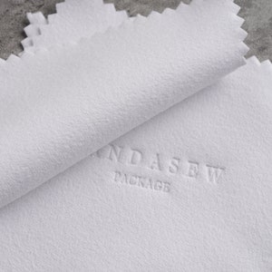 cleaning cloth with debossed logo