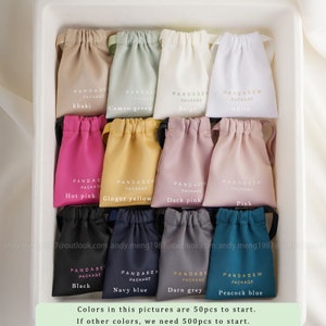 50 pcs to start for each available color satin bag