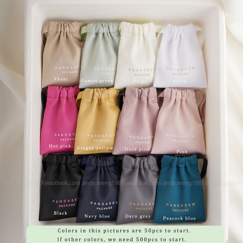 50 pcs to start for each available color satin bag