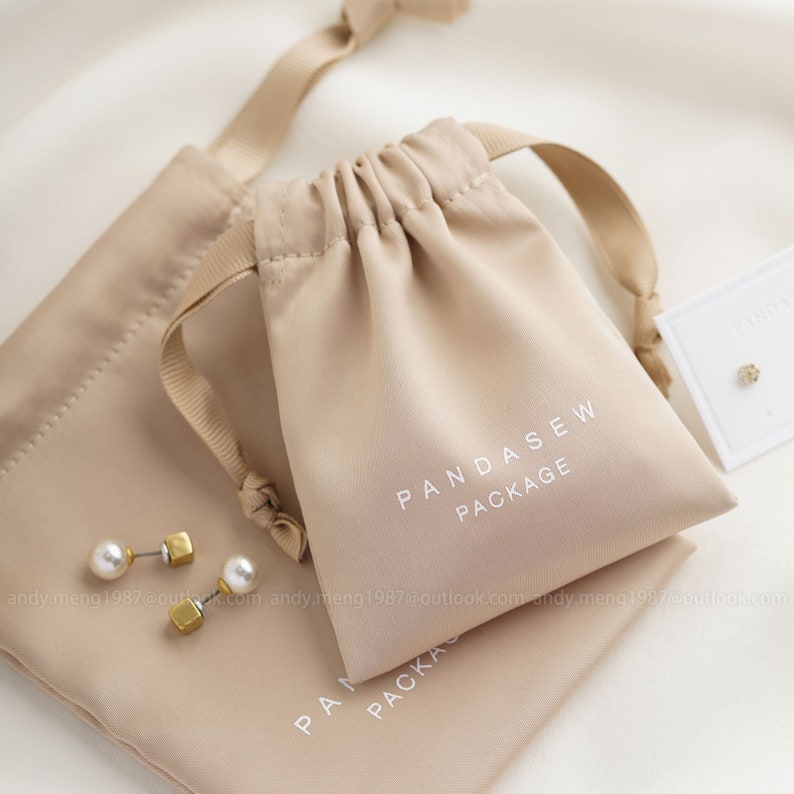 dense thick satin bag in khaki color, earrings pouch