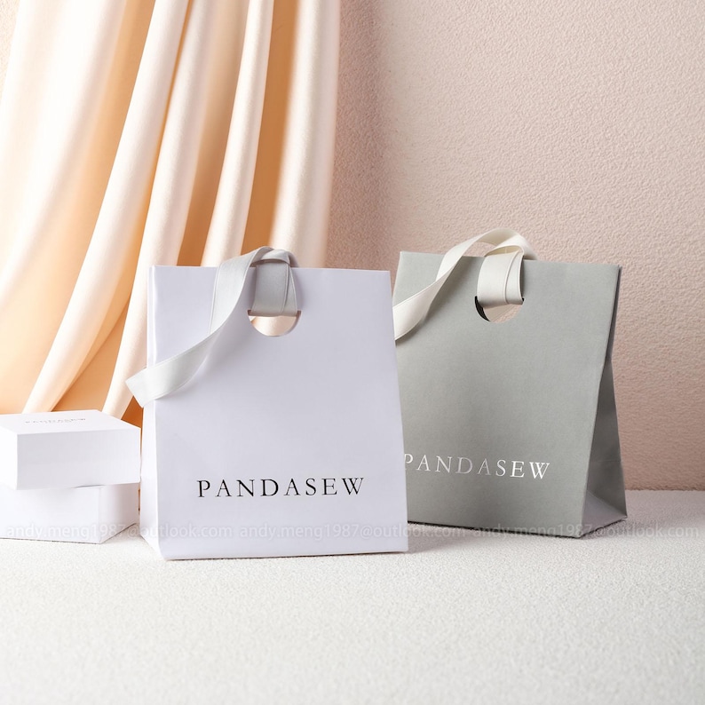 white and gray paper party bags, D shape holes bag