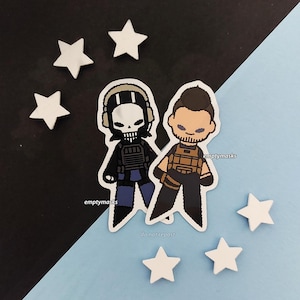 May include: Two die-cut stickers featuring stylized cartoon characters. One character wears a skull mask, headset, and tactical vest. The other character has a beard, short dark hair, and a tan tactical vest. Five small white star shapes surround them.