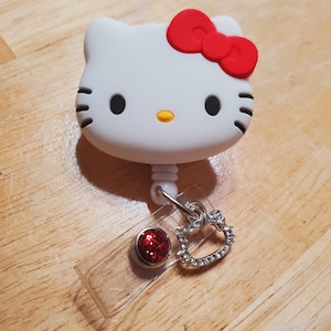 Cute Kitten with Red Bow badge reel