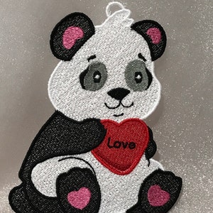 May include: Embroidered panda bear holding a red heart with the word "Love" on it. The panda has black and white fur with pink accents on the ears and feet.