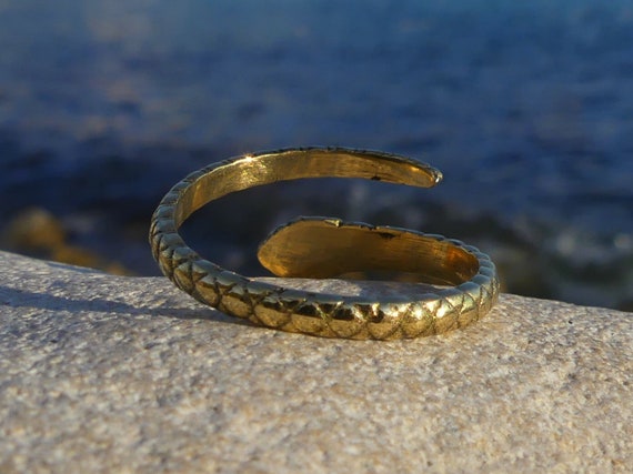 The Enchanting Tale of Our Gold Serpent Ring with Emerald Eyes
