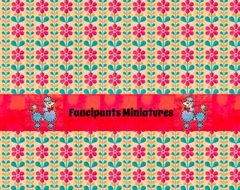 May include: A patterned background with a repeating floral design in pink, teal, and yellow on a beige backdrop. A red banner across the image features the text "Fancipants Miniatures" and a blue poodle illustration.