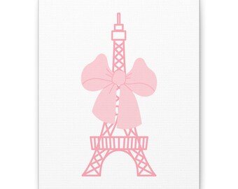May include: Pink Eiffel Tower illustration with a large bow on a white background. The tower is a simple outline, and the bow is centered on the tower. The artwork is on a canvas.